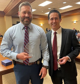 DA Investigator Clint Benson and District Attorney Jacob Putman pose for a picture during Commissioners Court on June 24, 2025
