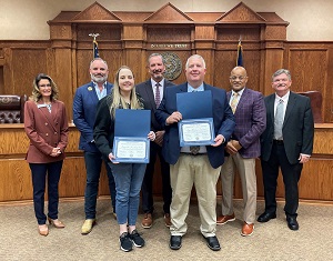 Lindale Police Sgt. Michael Lazarine and Dispatcher Kimberly Smith received Community Hero Awards from the Commissioners Court.